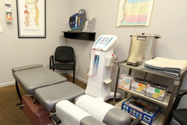 Chiropractic adjustment table in treatment room