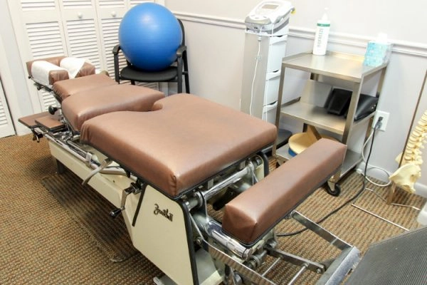 Chiropractic adjustment table with spine model